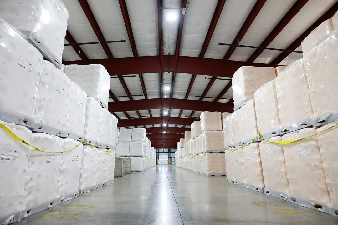 One of Cal-Chlor's Lare warehouses of product. Product is stacked on pallets framing a doorway.